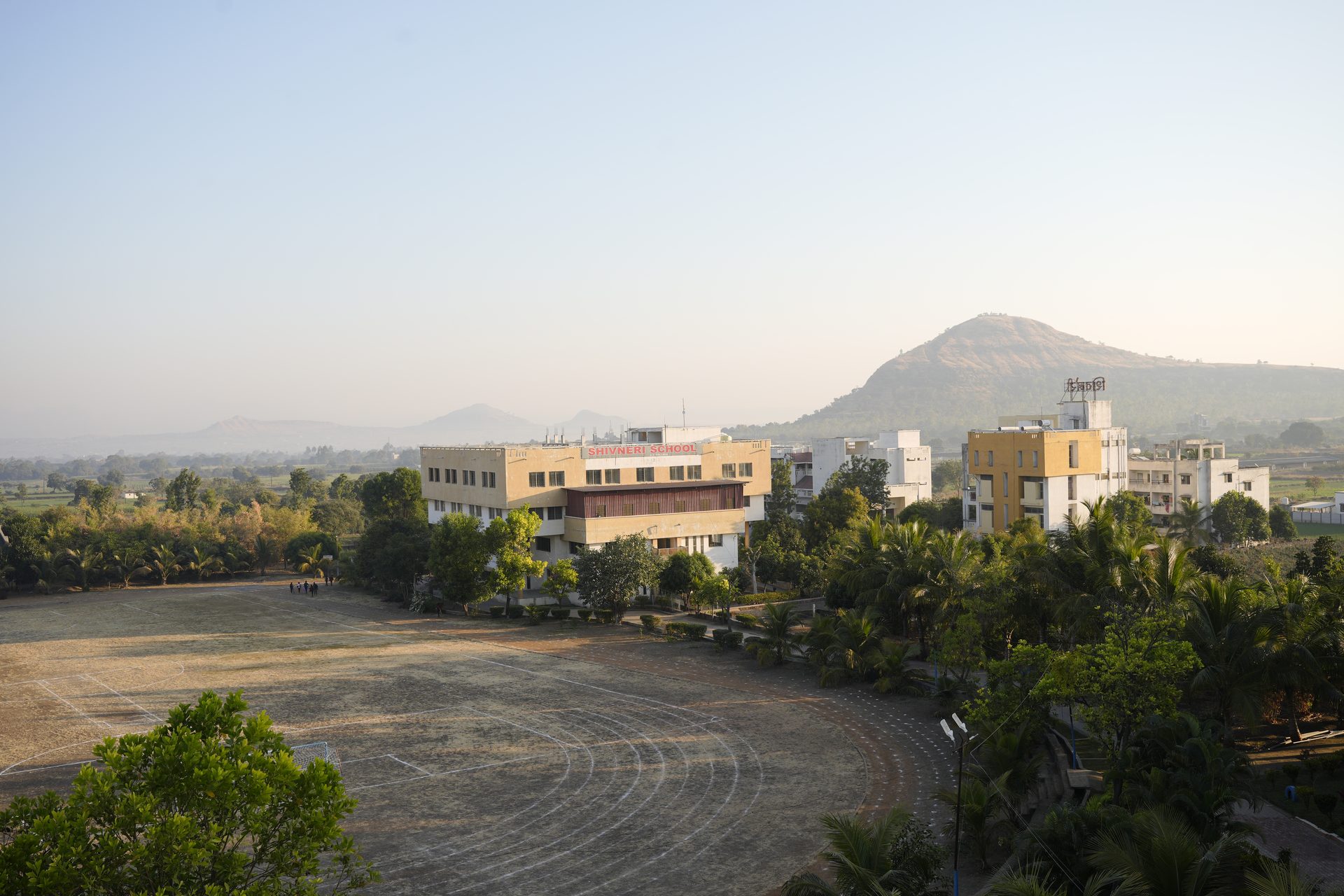 Aerial view of the Shivneri School building and running track